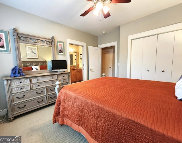 carpeted bedroom with ceiling fan, connected bathroom, and a closet