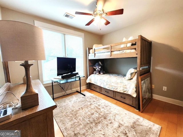 bedroom featuring wood-type flooring and ceiling fan