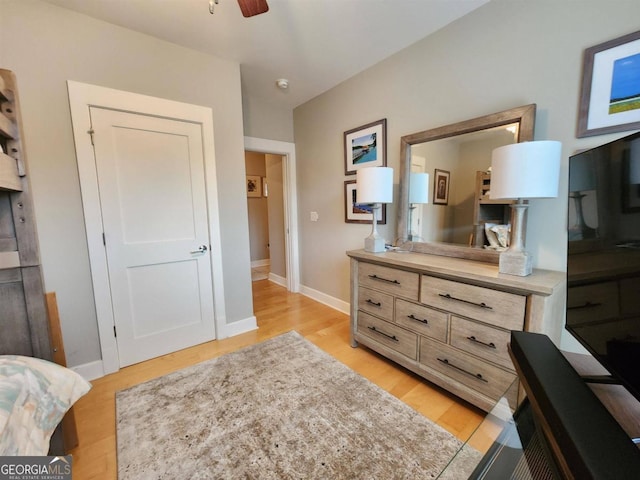 bedroom with ceiling fan and light hardwood / wood-style flooring