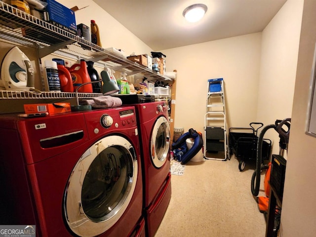 clothes washing area with washing machine and clothes dryer