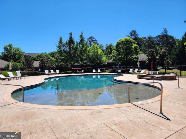 view of pool with a patio