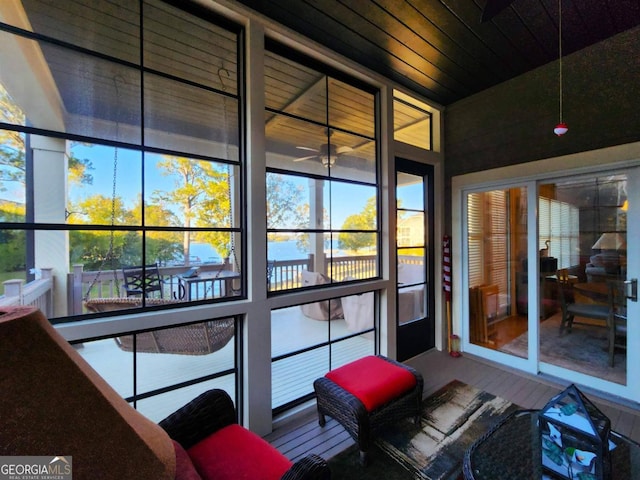 sunroom / solarium with ceiling fan