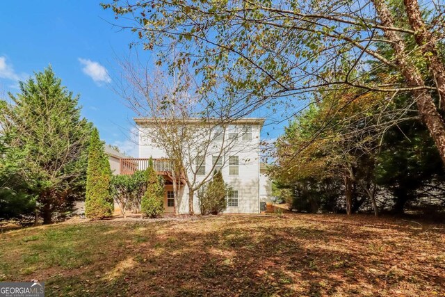 exterior space with a lawn and a deck