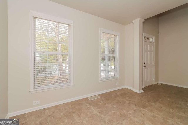 spare room featuring a wealth of natural light
