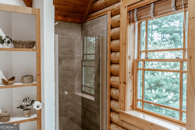 bathroom featuring wooden ceiling, a wealth of natural light, and vaulted ceiling