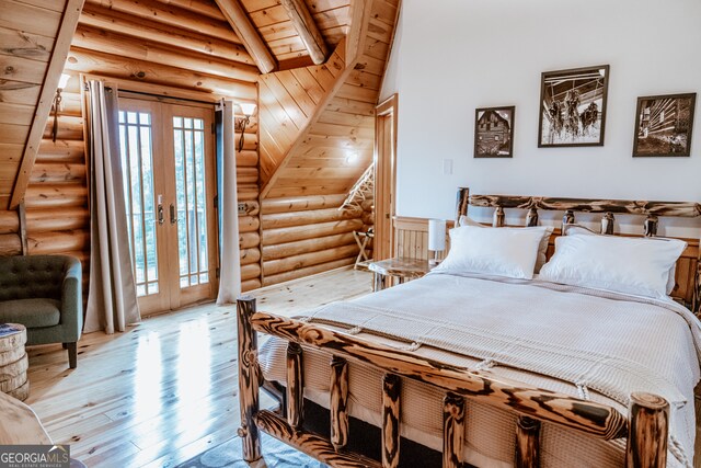 bedroom featuring access to outside, french doors, vaulted ceiling with beams, wooden ceiling, and light hardwood / wood-style flooring