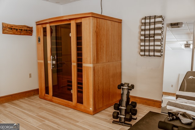 exercise area featuring wood-type flooring