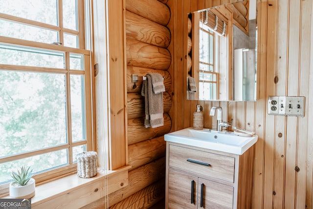 bathroom featuring vanity and a healthy amount of sunlight