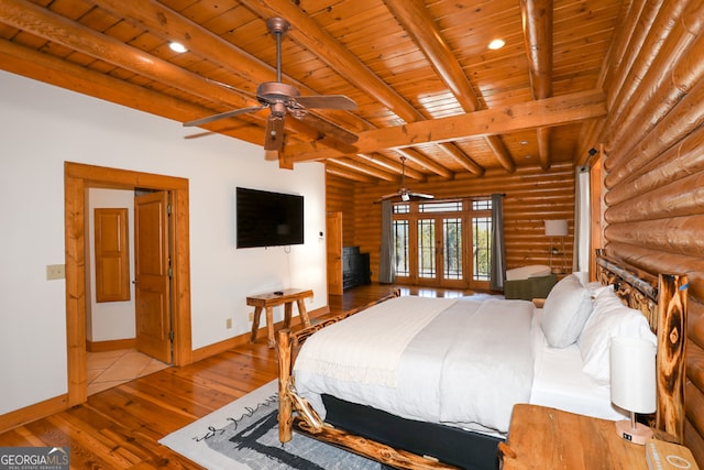 bedroom featuring wooden ceiling, beamed ceiling, light hardwood / wood-style flooring, and log walls