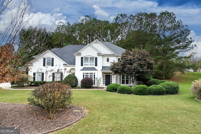 view of front facade featuring a front yard