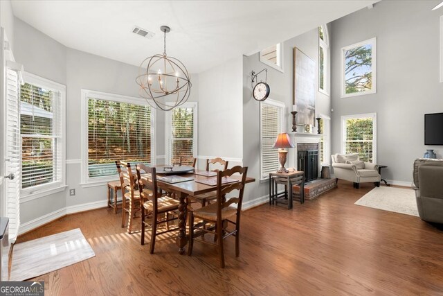 5 Arabian Ave, Alpharetta, GA 30004 - dining space with baseboards, an inviting chandelier, visible vents, and wood finished floors