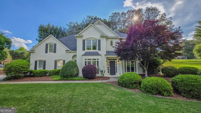 5 Arabian Ave, Alpharetta, GA 30004 - traditional-style home with a standing seam roof, brick siding, and a front lawn