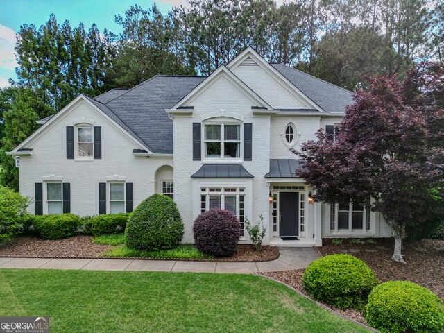5 Arabian Ave, Alpharetta, GA 30004 - traditional home featuring a front lawn and brick siding