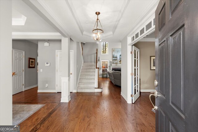 5 Arabian Ave, Alpharetta, GA 30004 - living room with baseboards, ceiling fan, crown molding, wood finished floors, and a high ceiling