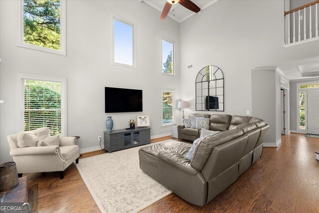 5 Arabian Ave, Alpharetta, GA 30004 - living area featuring wood finished floors, visible vents, stairway, a high ceiling, and baseboards