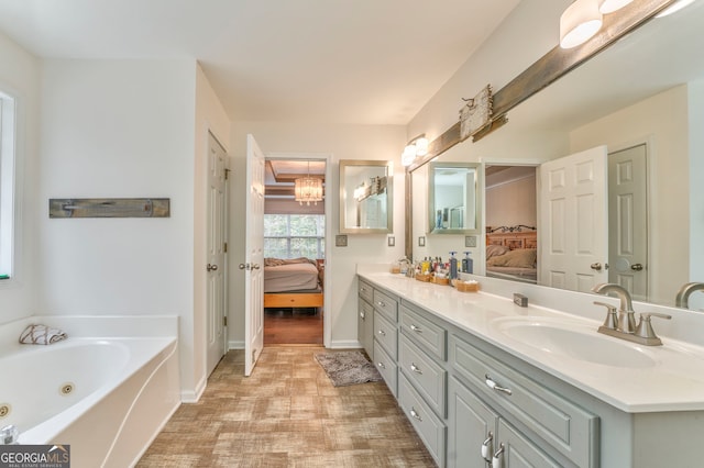 bathroom with a bathing tub and vanity