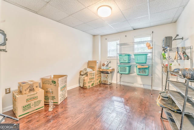 misc room featuring a drop ceiling and hardwood / wood-style floors