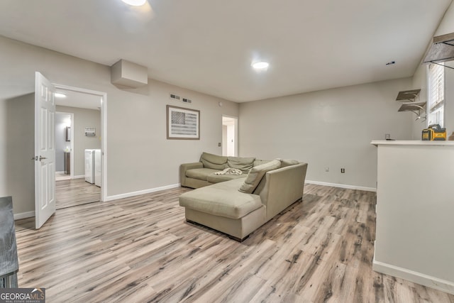 living room with light hardwood / wood-style flooring