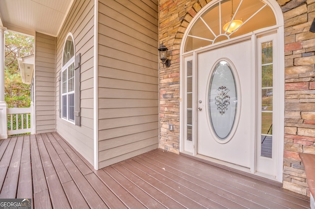 doorway to property featuring a porch