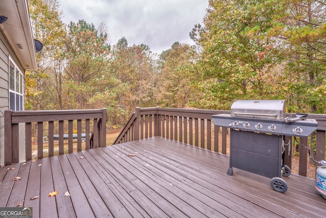 wooden deck featuring area for grilling