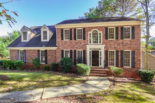 colonial home with a front yard