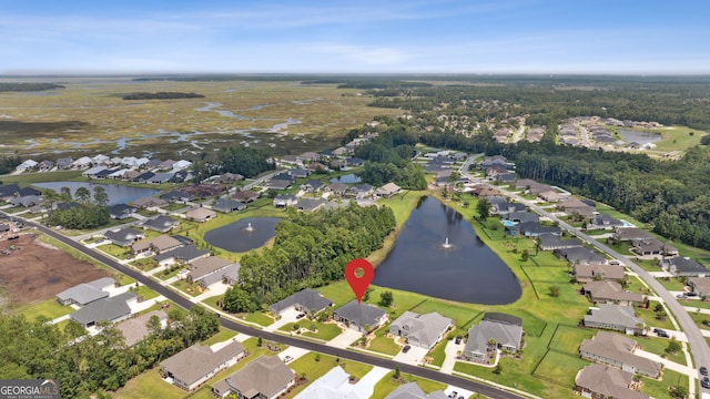 drone / aerial view with a water view