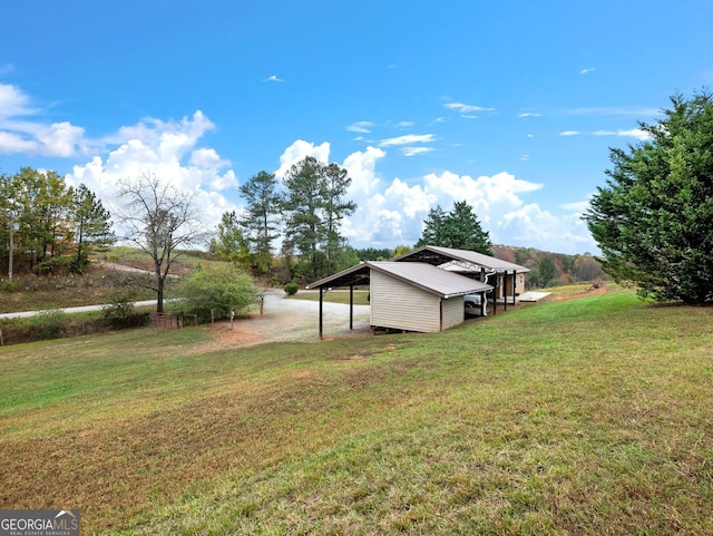 view of yard featuring a rural view and a carport