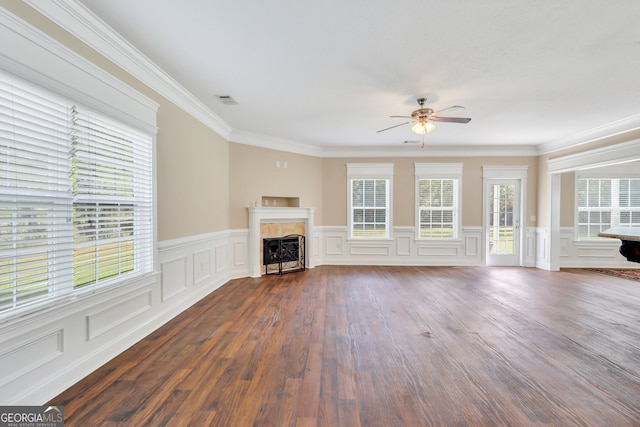 unfurnished living room with ceiling fan, dark hardwood / wood-style flooring, and ornamental molding