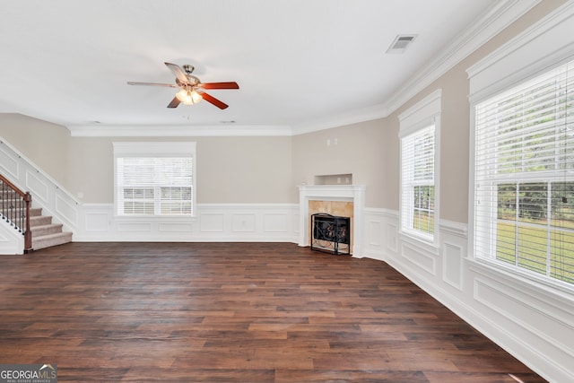 unfurnished living room with dark hardwood / wood-style flooring, ceiling fan, and crown molding