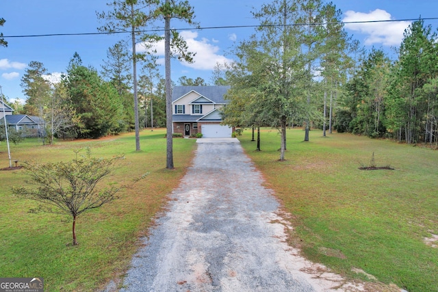 view of front of home with a garage and a front lawn