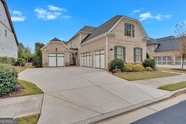 view of front property featuring a garage and a front lawn