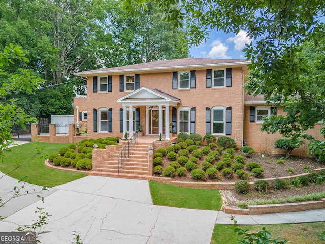 colonial home with a front yard