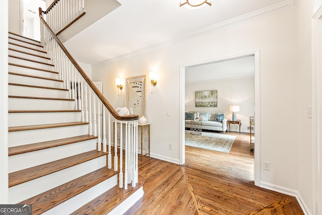 staircase featuring crown molding