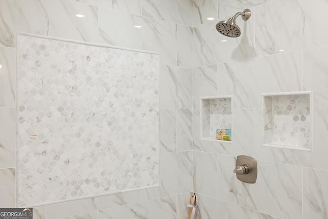 details featuring a tile shower