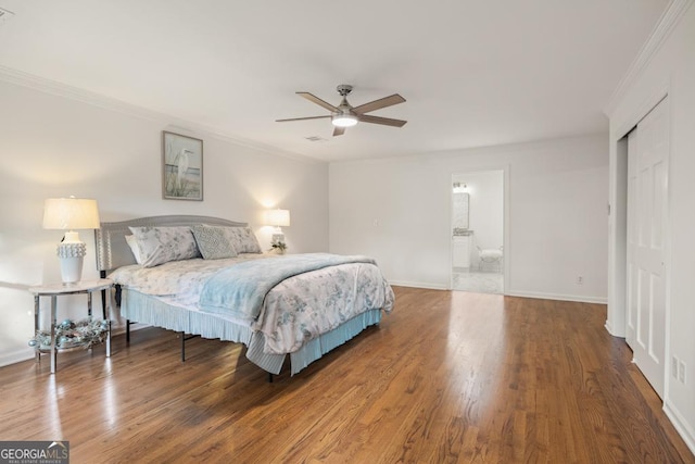 bedroom with ensuite bath, ceiling fan, crown molding, a closet, and hardwood / wood-style flooring