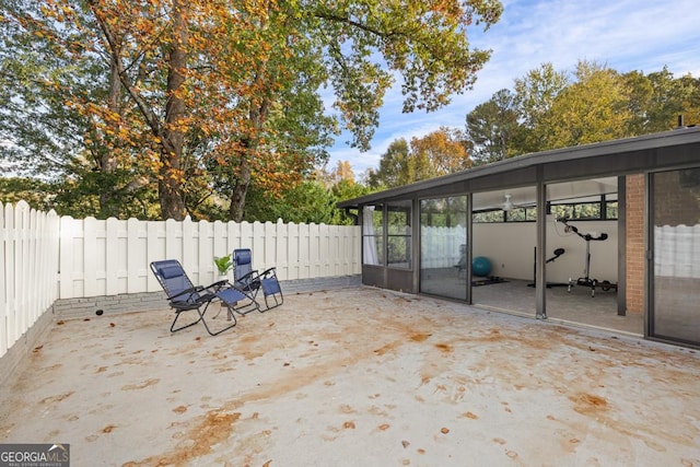 view of patio / terrace featuring a sunroom