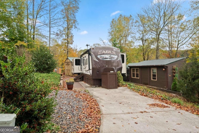 view of home's exterior featuring a shed