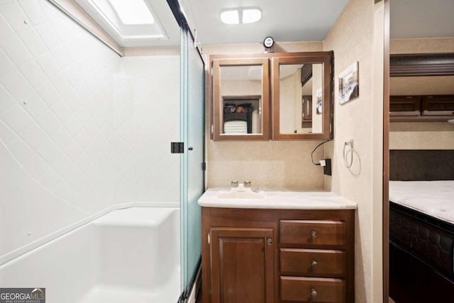 bathroom with vanity and decorative backsplash