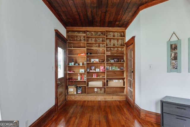 interior space with dark hardwood / wood-style flooring, wood ceiling, and vaulted ceiling