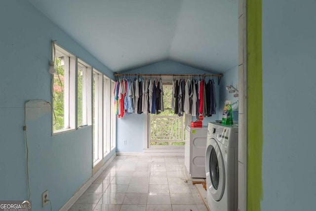 clothes washing area with separate washer and dryer