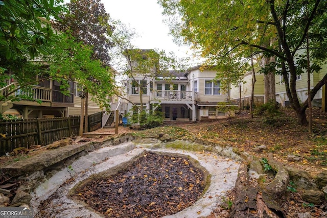 rear view of house with a wooden deck