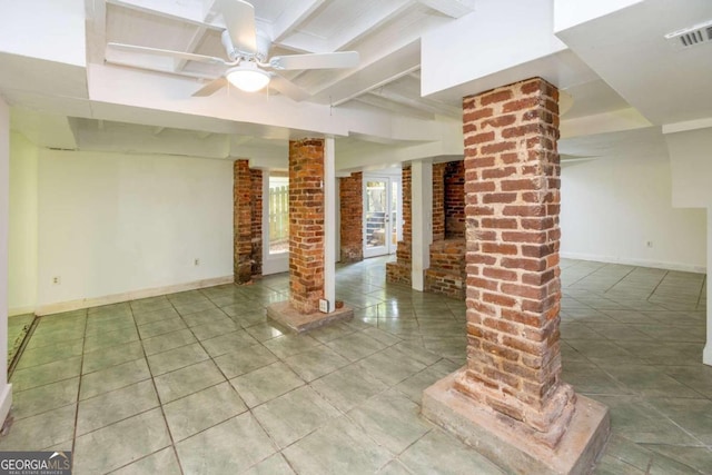 unfurnished room with beamed ceiling, ceiling fan, tile patterned floors, and ornate columns