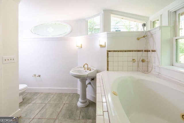 bathroom featuring a bathing tub and toilet