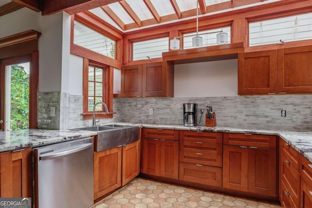 kitchen with sink, light stone counters, tasteful backsplash, stainless steel dishwasher, and vaulted ceiling with beams