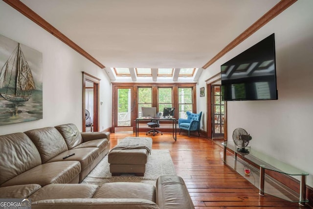 living room featuring hardwood / wood-style floors and crown molding