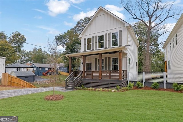 view of front of property with a front yard and covered porch