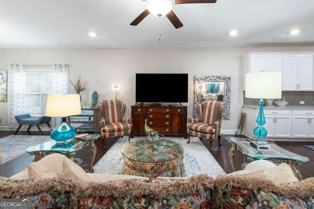 living room with hardwood / wood-style flooring and ceiling fan