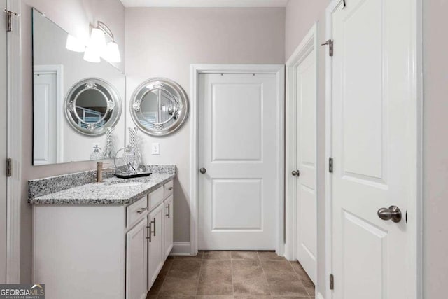 bathroom with vanity and tile patterned floors