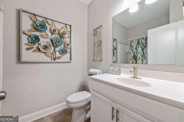 bathroom with vanity, a shower with shower curtain, tile patterned flooring, and toilet