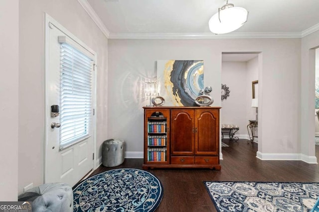 entrance foyer with dark hardwood / wood-style floors and crown molding